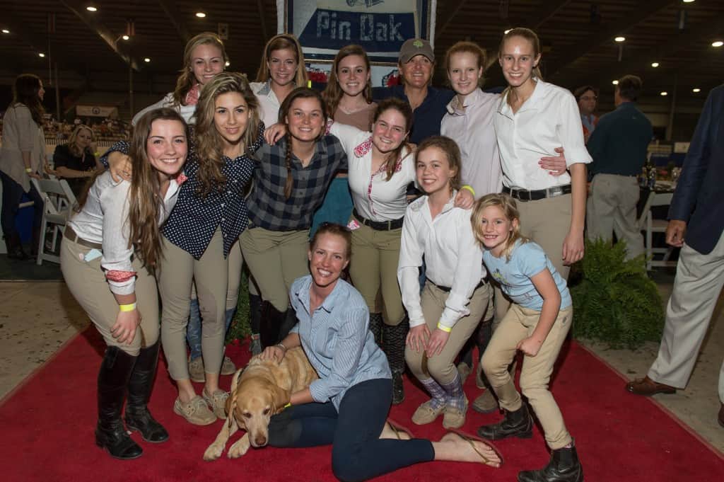 Irish Day Farm was the Title Sponsor of The Pin Oak Charity Horse Show in 2013 and returns as a Title Sponsor for Week II, March 25-30, for the 69th Pin Oak Charity Horse Show. Pictured L to R:  Stuart the beloved Irish Day Farm barn dog, Morgan Erbotosser – Assistant Trainer at Irish Day, Sarah Rothwell, Lorin Salazar, Jazz Hawk, Sarah Brooks, Reese Silberman, Ellen Jones, Peyton Tanner, Chrissie Lookie, Mary Clare Ganucheau, Katie Lambert-Boone – Owner/Head Hunter-Jumper Trainer at Irish Day Farm, Grace Edwards, Catherine Coselli Photo Credit: Fulton Davenport