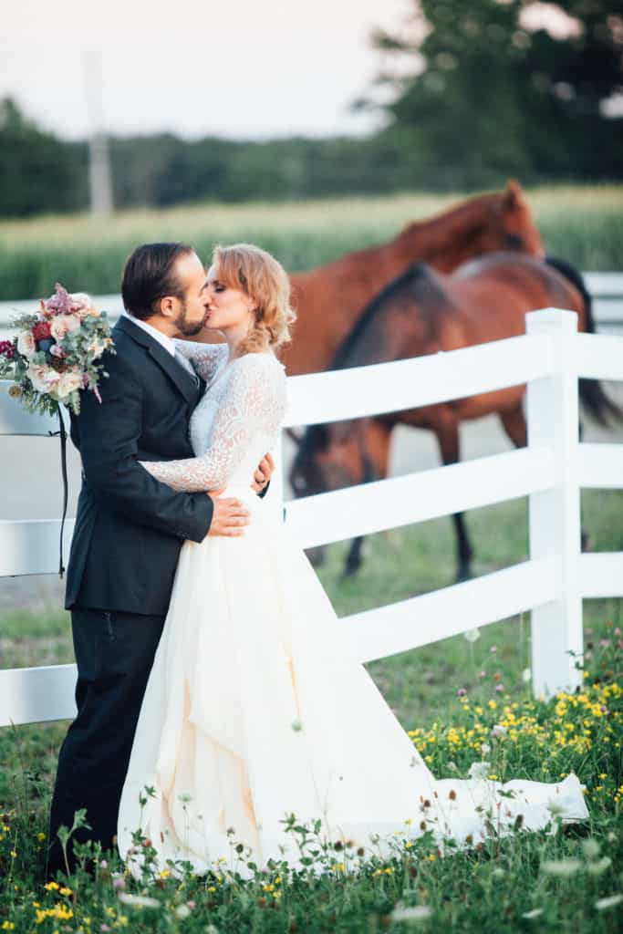 White Horse Livery in West Middlesex, PA equestrain wedding styling and photography by Tami Weingartner. Film photography by Nicole Cassano. Florals by Sapphire & Lace. Jewelry by The Gift Horses. Invitations by Dot & Bows Paperie. Rentals by Vintage Vogue Furnishings. Dress by Lace & Liberty. Hair & MUA by Laurie Conti and Lauren Frye. Cake by Renee Hartwell. Polo gear from Powers Polo School.